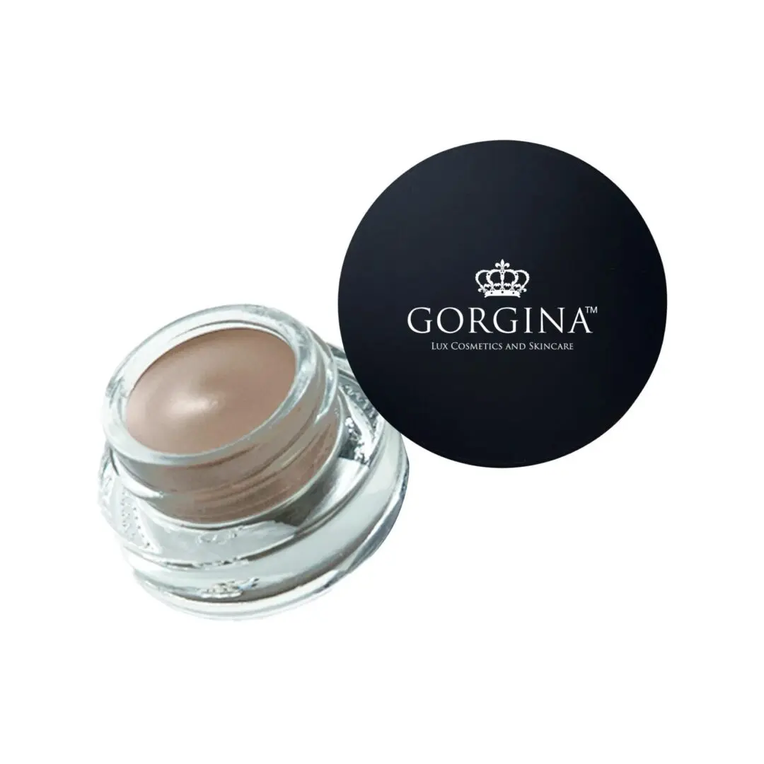 Open jar of beige cream makeup with a black lid beside it labeled "Gorgina Lux Cosmetics and Skincare.