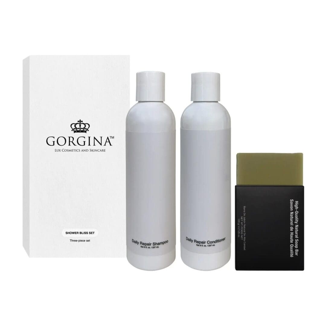 Gorgina Lux Cosmetics Shower Bliss Set with shampoo, conditioner, and a nourishing olive extract soap bar beside a white box.