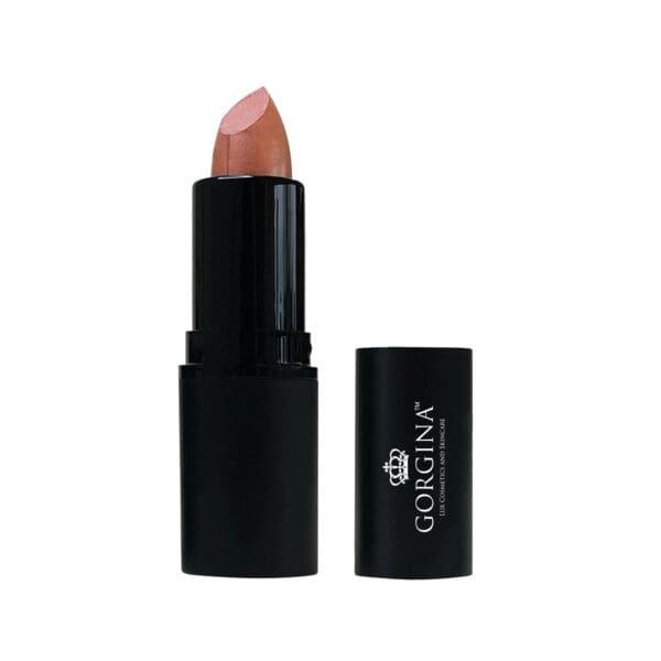 A tube of peach-colored lipstick with its black cap beside it.