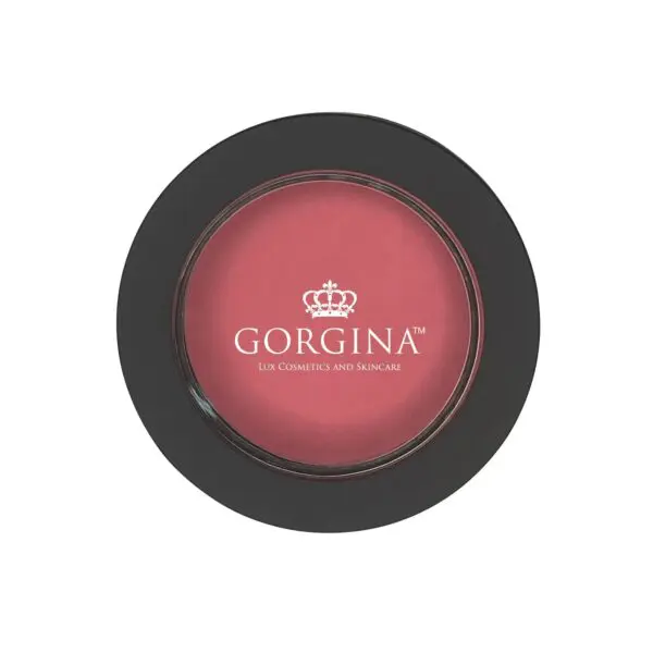 Compact case of Gorgina blusher with a black outer rim. The blusher is a pink shade and has a crown logo and text reading "Gorgina Lux Cosmetics and Skincare" on the front.