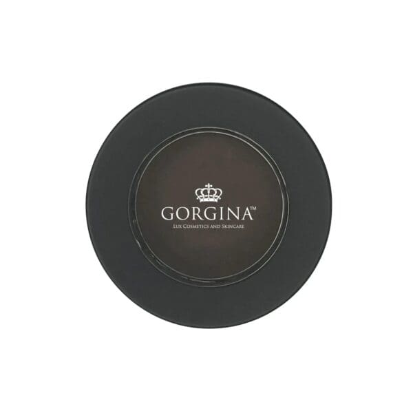 A round black container with the label "Gorgina Lux Cosmetics and Skincare" featuring a crown logo in the center.