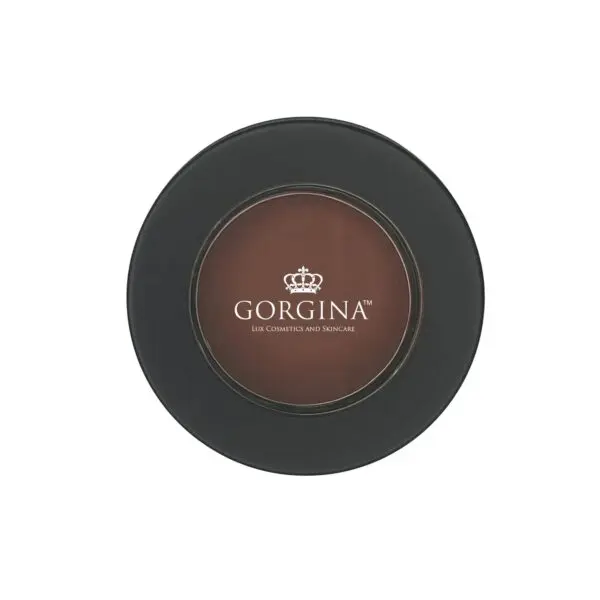 A round, black compact case of Gorgina Lux Cosmetics and Skincare, featuring a brown powder inside.