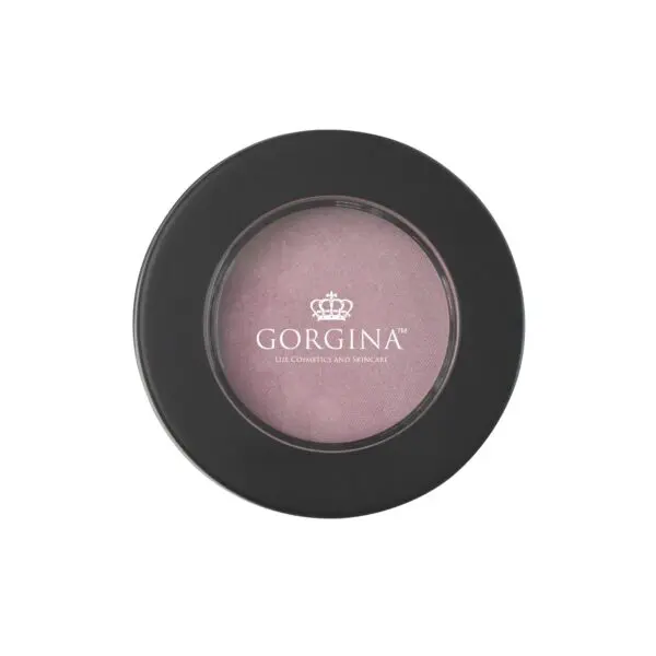 Round black compact case with transparent lid displaying pink blush inside. "Gorgina Lux Cosmetics and Skincare" text and crown logo on lid.