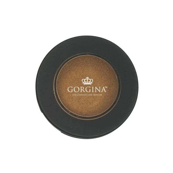 Round black makeup compact with a brown eyeshadow inside, labeled "Gorgina Lux Cosmetics and Skincare" with a crown logo on the lid.