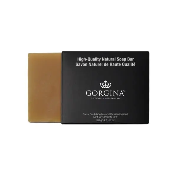 A bar of Gorgina high-quality natural soap partially slides out of its black packaging. Text on the packaging is in English and French.