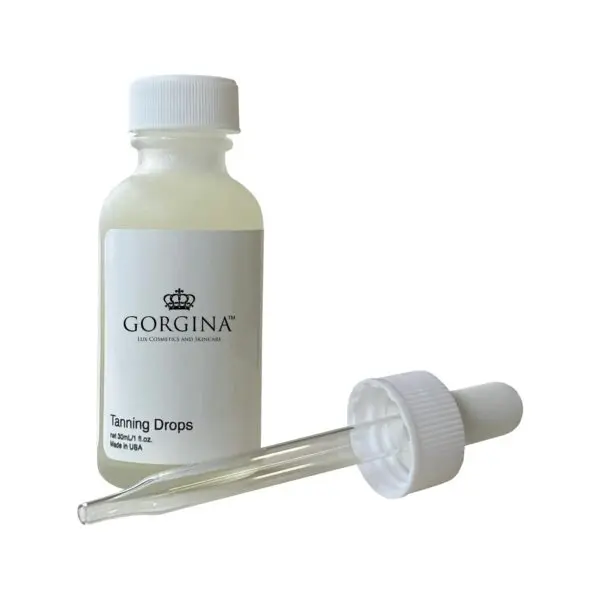 Clear bottle labeled "Gorgina Tanning Drops" with a separate dropper cap beside it on a white background.