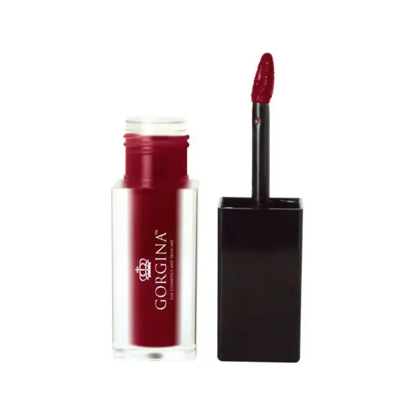 Open liquid lipstick container in deep red shade with applicator wand.