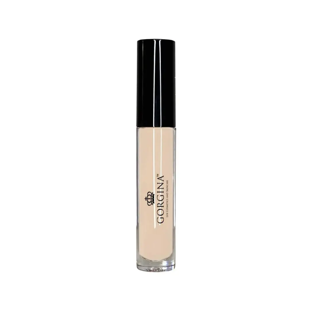 A cylindrical lip gloss container with a black cap and a clear body, showing a nude shade product inside.