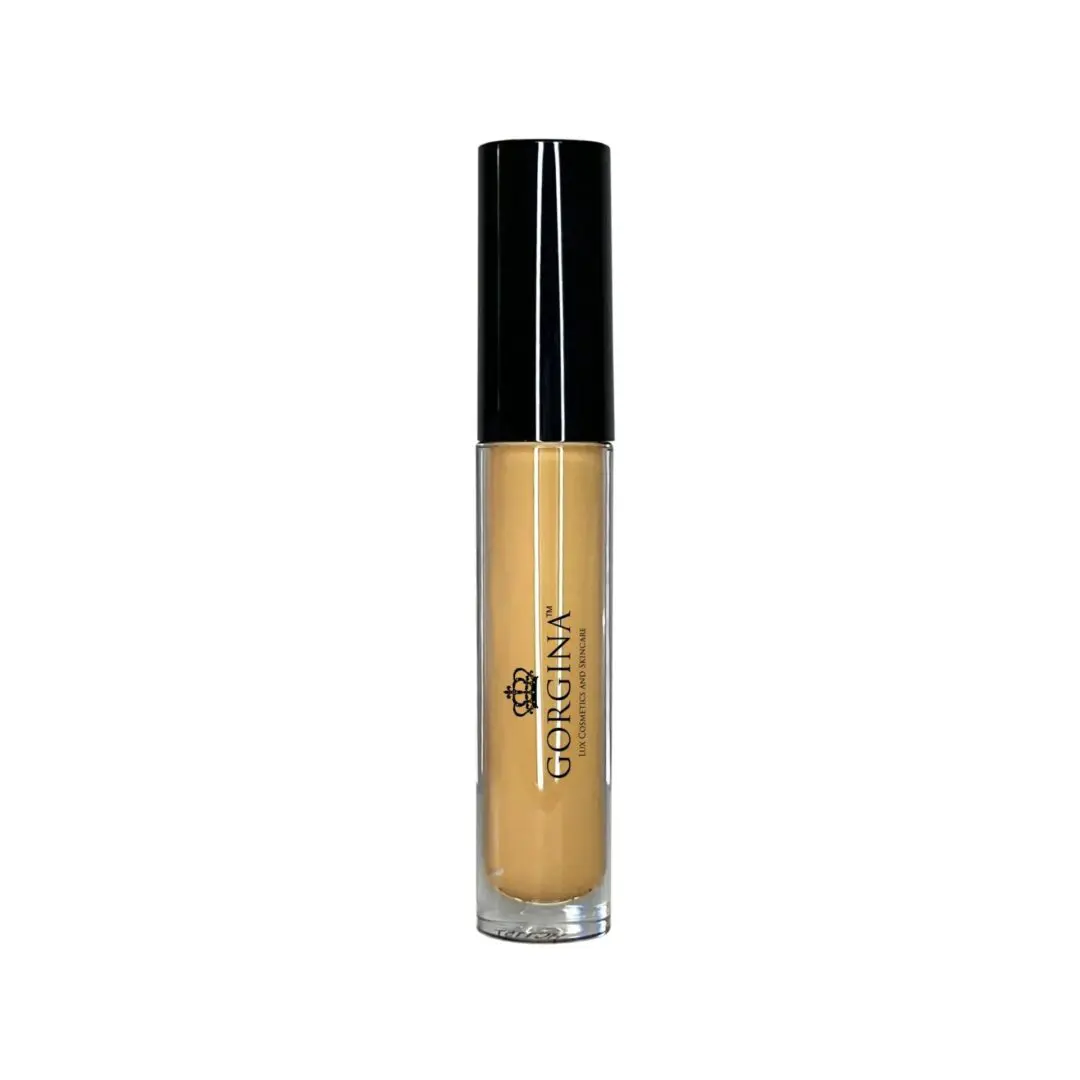 A clear tube of Georgina lip gloss with a black cap, containing a nude beige color.