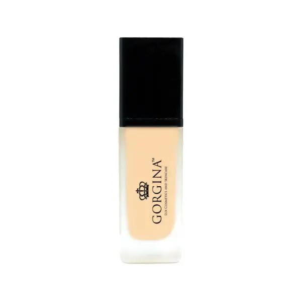 A bottle of liquid foundation labeled "Gorgina," featuring a black cap and a transparent bottle displaying the light beige product inside.