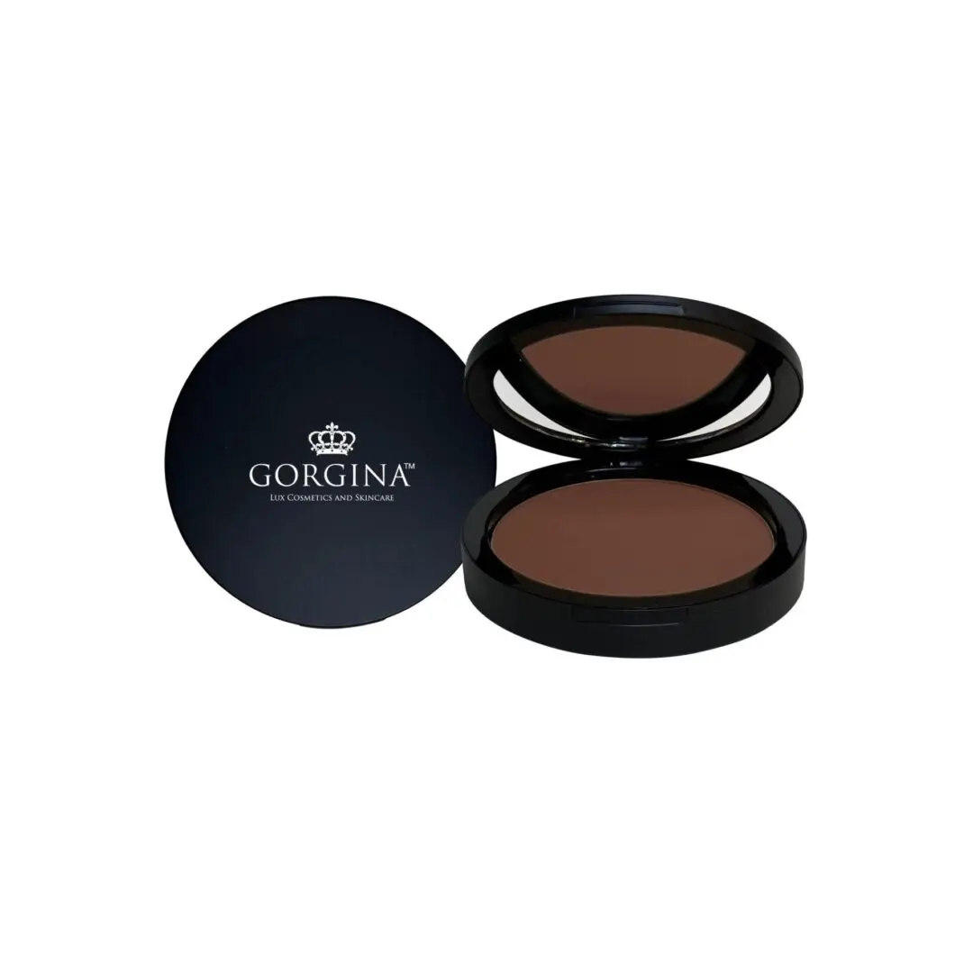 Dark makeup compact with a round case, opened to show the powder and mirror, next to its closed lid on the left, labeled "Gorgina.