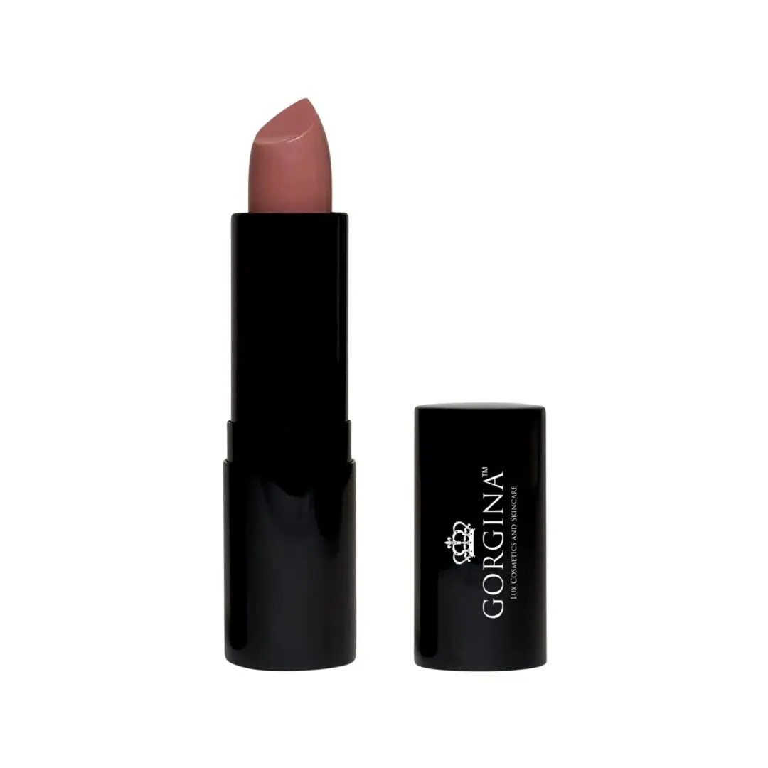 A lipstick in a black tube with the cap off is displayed. The lipstick is a matte, muted pink shade.