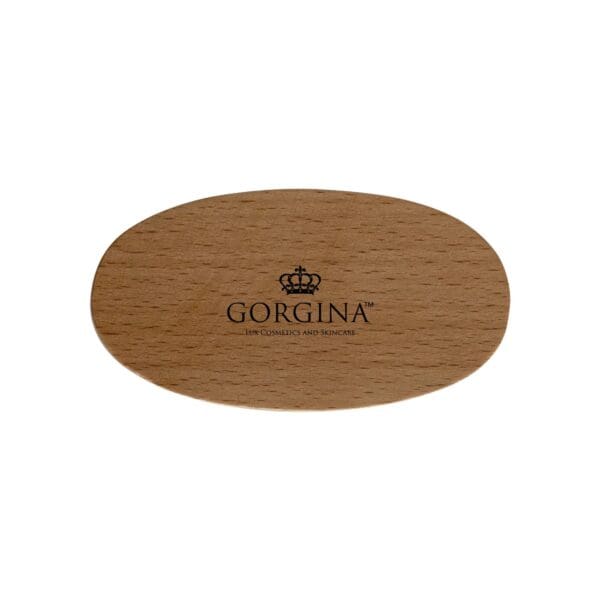 Wooden oval hairbrush with a crown logo and the text "Gorgina, 19th Cosmetics and Sundries.