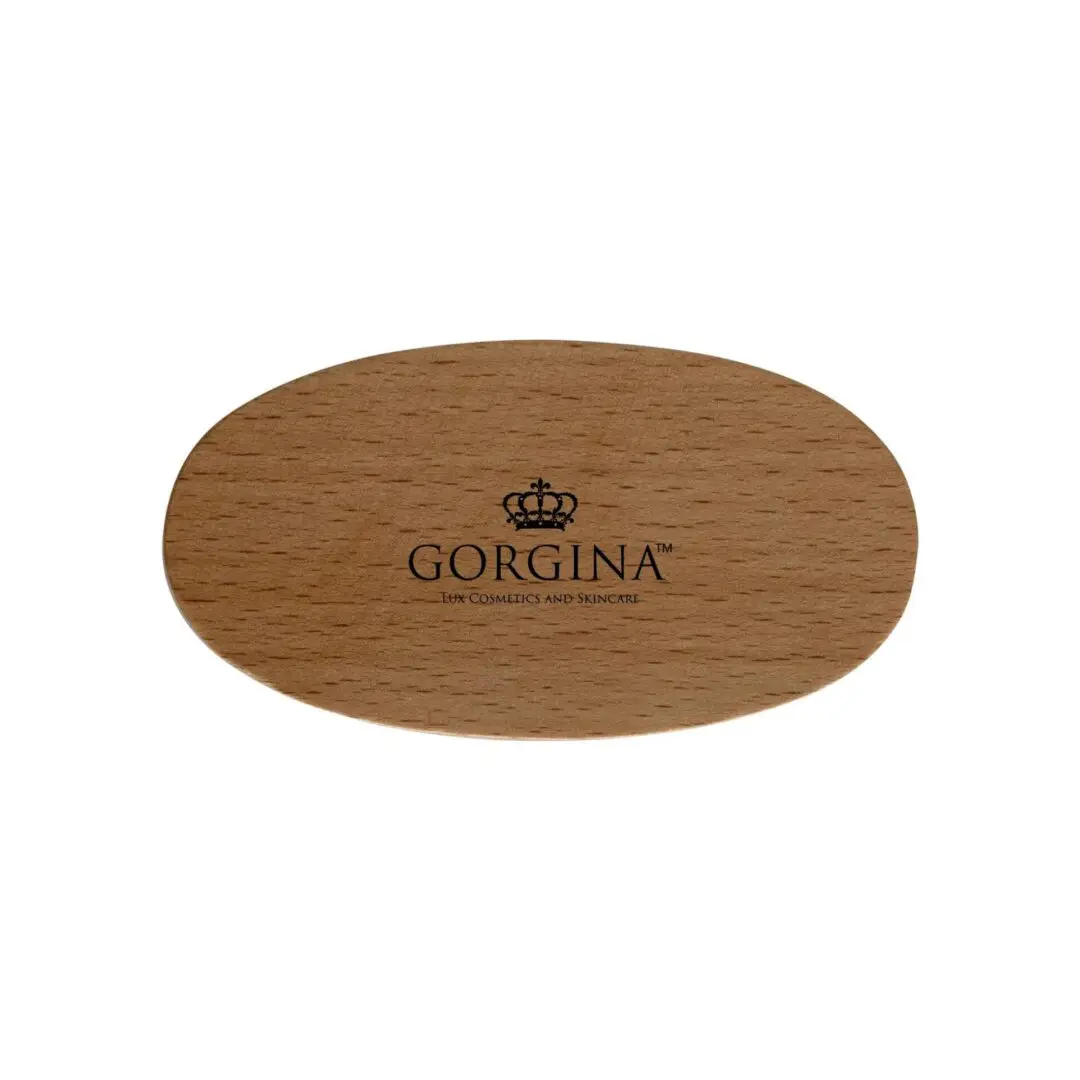 Wooden oval hairbrush with a crown logo and the text "Gorgina, 19th Cosmetics and Sundries.