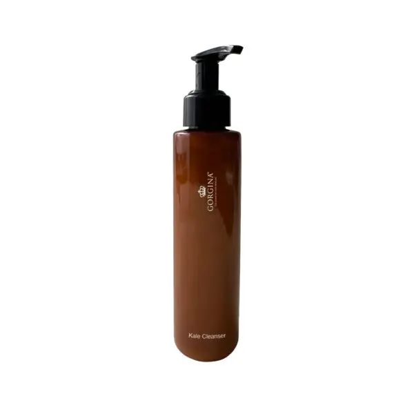 A brown bottle with a black pump dispenser labeled "Kale Cleanser.