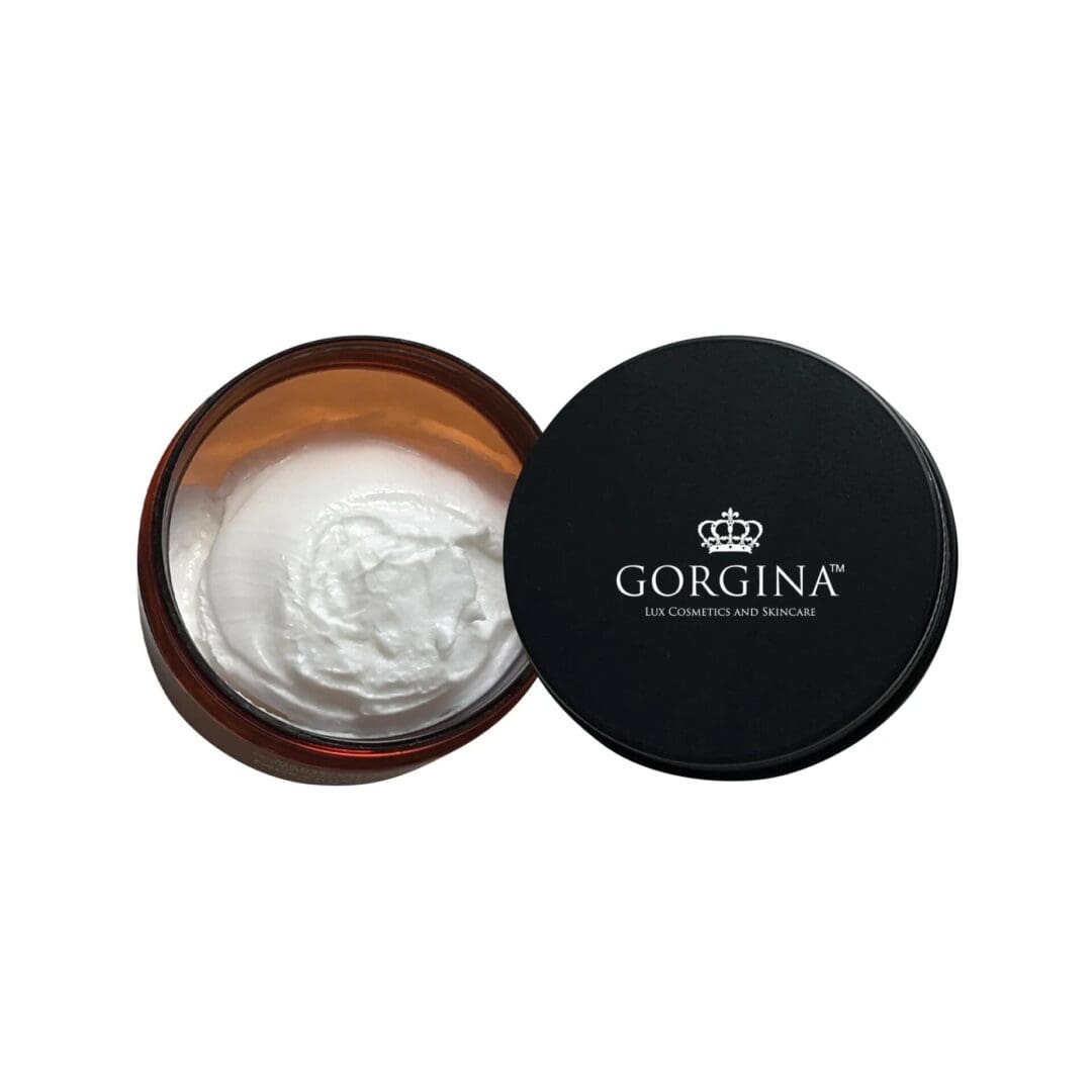 Open jar of white cream with a black lid labeled "Gorgina Lux Cosmetics and Skincare.