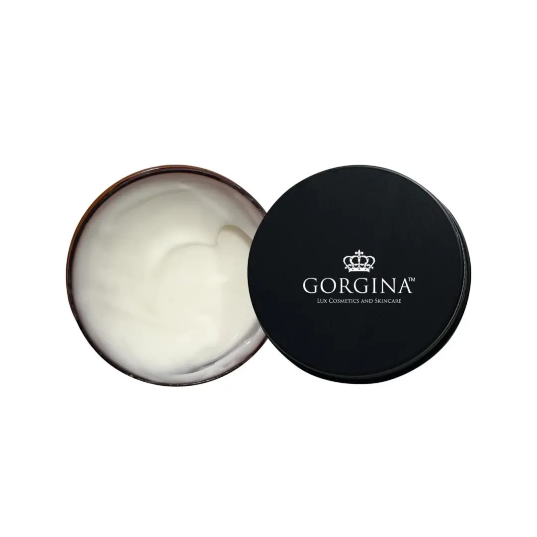 Open container of Gorgina Lux Cosmetics cream with black lid displaying the brand logo.