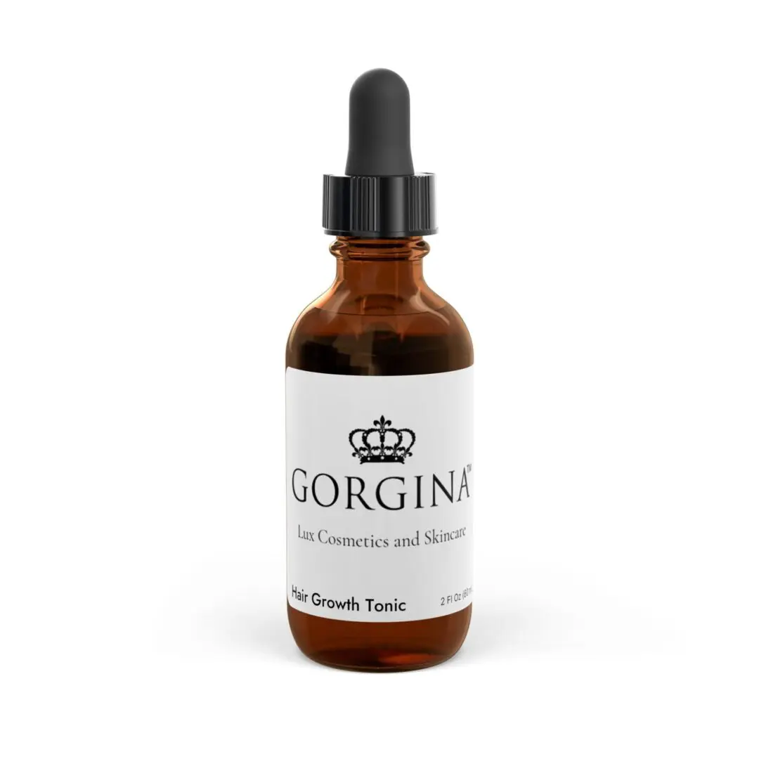 A brown glass dropper bottle featuring a label for "Hair Growth Tonic, 2oz" by Gorgina Lux Cosmetics and Skincare, complete with a black dropper cap.