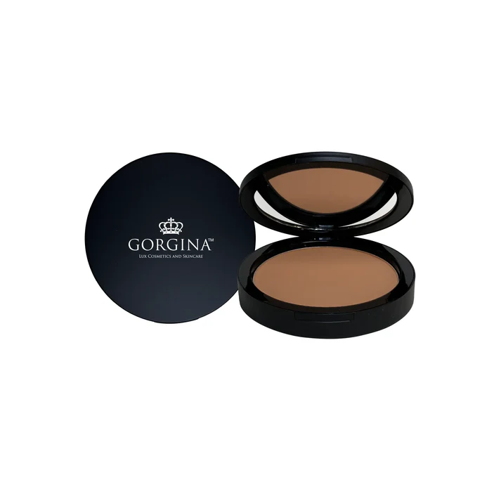 A compact powder with a black lid and a brown box.