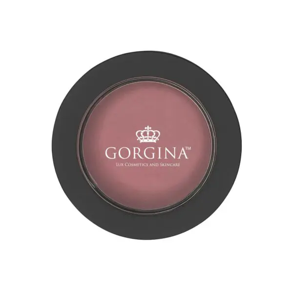 A round container of Gorgina Lux Cosmetics and Skincare blush with a black lid and transparent top showing the pink blush inside.