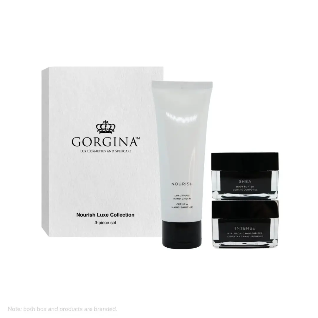 A Gorgina Nourish Luxe Collection 3-piece skincare set, including a tube and two jars, displayed next to a white branded box.