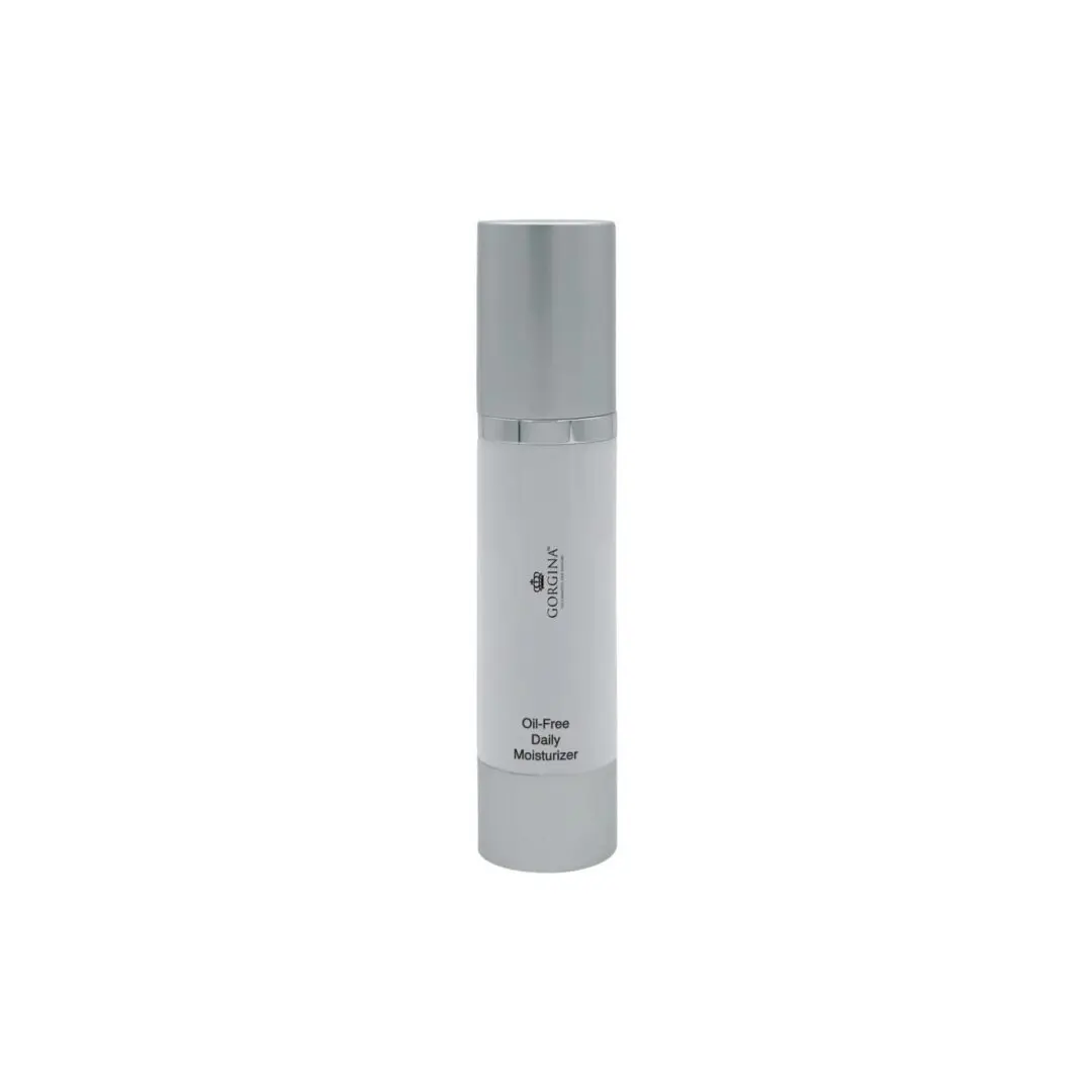 A cylindrical white bottle with a silver cap labeled "Oil-Free Daily Moisturizer" stands upright on a plain white background.