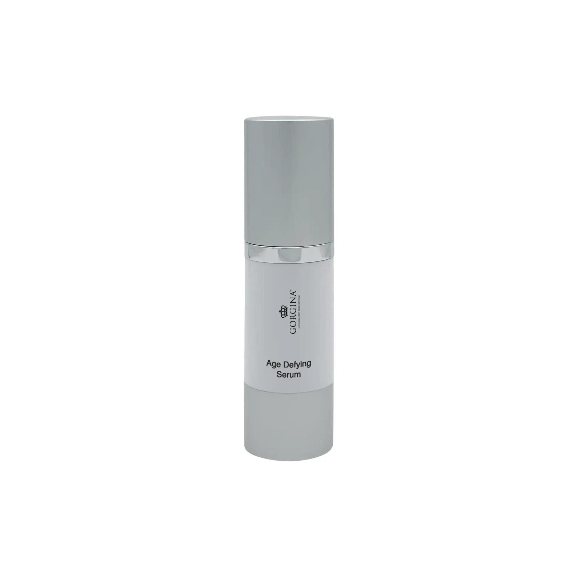 A silver and white bottle labeled "Age Defying Serum" from Coralina sits upright against a plain white background.