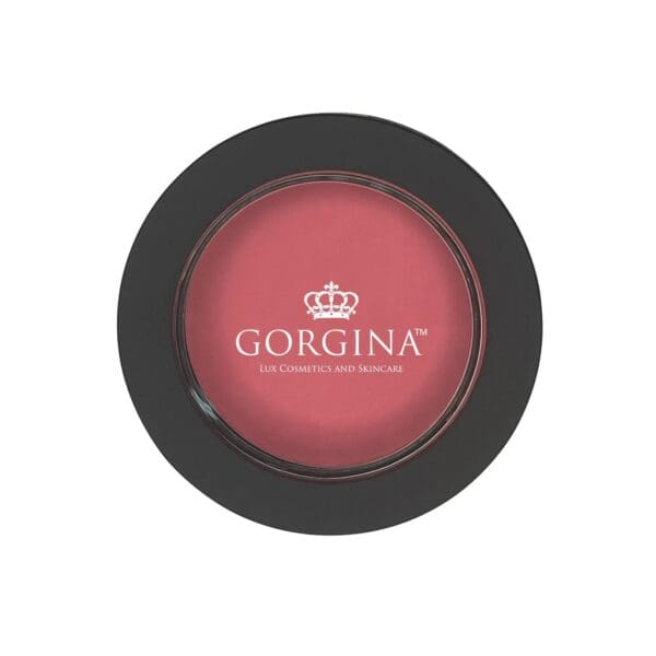 A round container of pink blush with a black rim, labeled "GORGINA Lux Cosmetics and Skincare" in white text on the lid.