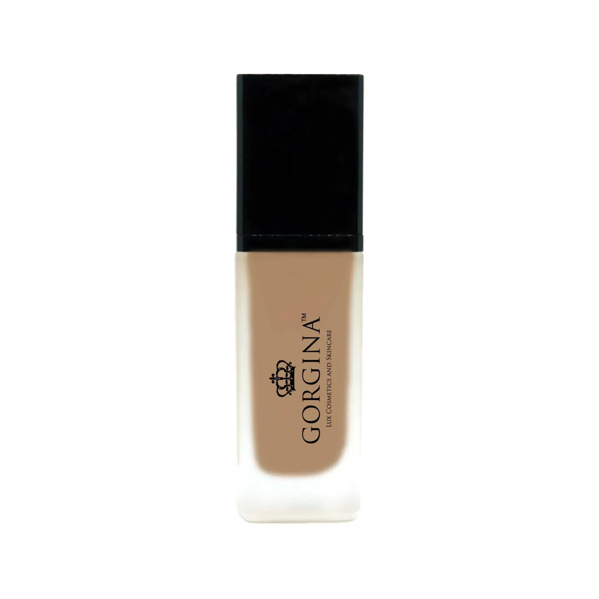 A frosted glass bottle with a black cap contains Gorgina liquid foundation, featuring the brand logo and text on the front.