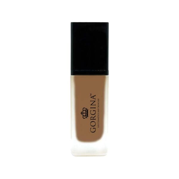 A rectangular bottle of Gorgina liquid foundation with a black cap and a frosted glass body showing medium brown product inside.
