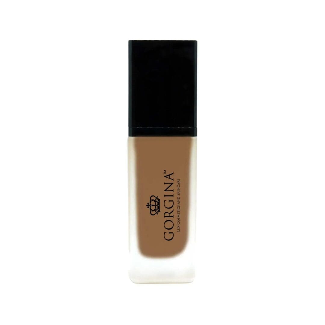 A rectangular bottle of Gorgina liquid foundation with a black cap and a frosted glass body showing medium brown product inside.