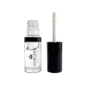 A clear lip gloss in a transparent tube labeled "Gorgina" with the applicator wand removed and standing next to it against a white background.